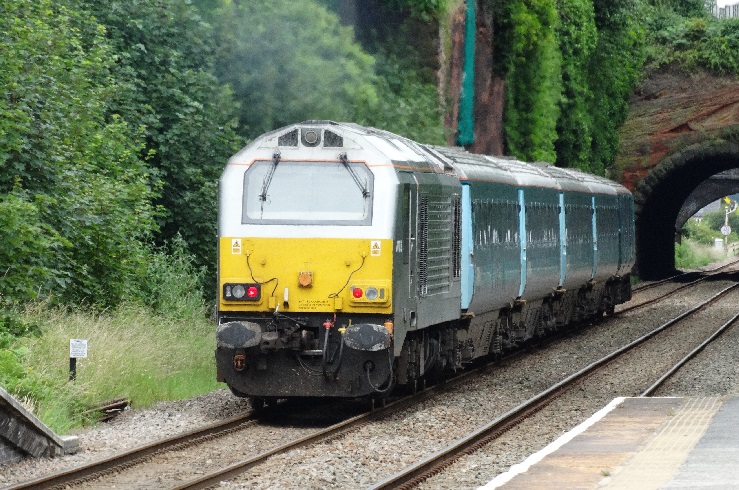 The 13.05 Holyhead to Manchester Piccadilly leaves Frodsham Railway Station